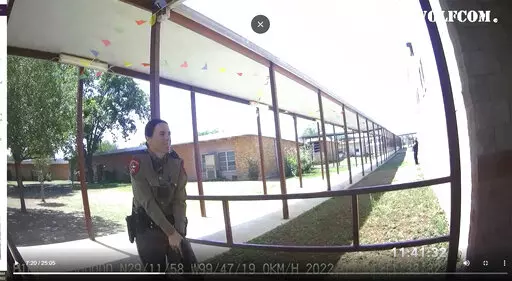 This image from video released by the City of Uvalde, Texas shows Texas Department of Public Safety trooper Crimson Elizondo responding to a shooting at Robb Elementary School, on May 24, 2022 in Uvalde, Texas.  The former Texas state trooper under investigation for the law enforcement response to the deadly school shooting in Uvalde has been hired by the school district as a campus police officer. (City of Uvalde via AP)