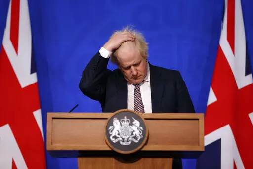 Britain's Prime Minister Boris Johnson gestures as he speaks during a press conference in London, Saturday Nov. 27, 2021, after cases of the new COVID-19 variant were confirmed in the UK. (Hollie Adams/Pool via AP)