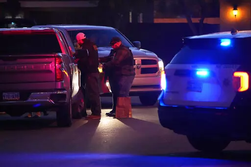 Las Vegas police work near the home of former actor Nathan Lee Chasing His Horse, who goes by Nathan Chasing Horse, Tuesday, Jan. 31, 2023, in North Las Vegas, Nev. Authorities raided the home of the former actor Tuesday in connection with a sexual assault investigation. (AP Photo/John Locher)
