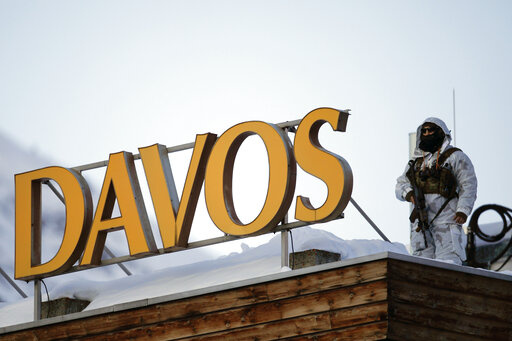 File---File picture taken Jan.24, 2022 shows a police security guard on the roof of a hotel ahead of the World Economic Forum in Davos, Switzerland. (AP Photo/Markus Schreiber,file)
