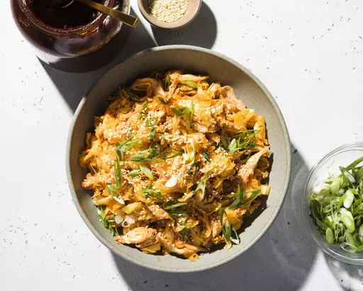 This image released by Milk Street shows a recipe for cabbage and chicken salad with gochujang and sesame. (Milk Street via AP)