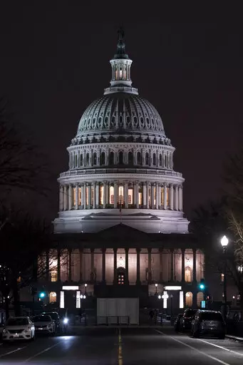 The Capitol is seen Wednesday evening as the House of Representatives works to approve the Respect for Marriage Act, a bill already passed in the Senate to codify both interracial and same-gender marriage, in Washington, Dec. 7, 2022. (AP Photo/J. Scott Applewhite)