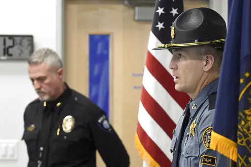 Oregon State Police, Capt. Kyle Kennedy, right, speaks to reporters during a news conference at Grants Pass police headquarters on Wednesday, Feb. 1, 2023, in Grants Pass, Ore. Kennedy, and Grants Pass Police Chief Warren Hensman, left, recounted the series of events in recent days that led to an armed standoff with a suspect in a violent kidnapping in Oregon who died after shooting himself, authorities said. Police now believe he also murdered two people in Sunny Valley, Ore. (Scott Stoddard/Gr