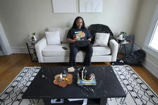 Odia Kaba works from home in Ypsilanti, Mich., Tuesday, May 23, 2023. Growing up in Ann Arbor, there was an expectation that Odia would attend the University of Michigan. When her application was deferred, she started at Eastern Michigan with plans to transfer to Ann Arbor her sophomore year. But she was getting daily texts from her sister, who attended U-M, describing the microaggressions she faced as a Black student on campus. Kaba stayed at Eastern Michigan and graduated with a degree in quan