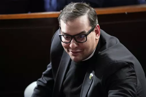 Rep. George Santos, R-N.Y., watches as Republicans try to elect Rep. Mike Johnson, R-La., to be the new House speaker, at the Capitol in Washington, Oct. 25, 2023. The House Ethics panel says it has found “substantial evidence” of lawbreaking by Republican Rep. George Santos of New York and has referred its findings to the Justice Department. (AP Photo/Alex Brandon, File)