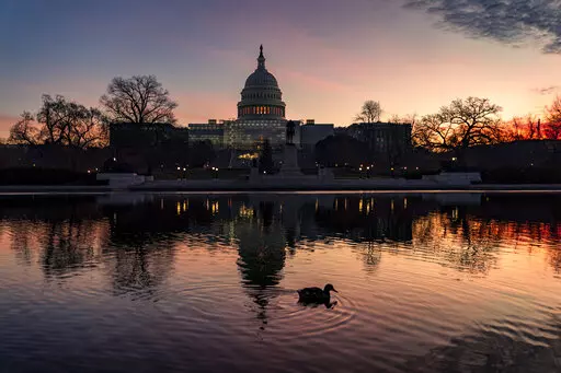 The Capitol is seen in Washington, early Wednesday, Dec. 14, 2022. Lawmakers leading the negotiations on a bill to fund the federal government for the current fiscal year say they've reached agreement on a "framework" that should allow them to complete work on the bill over the next week and avoid a government shutdown. (AP Photo/J. Scott Applewhite)