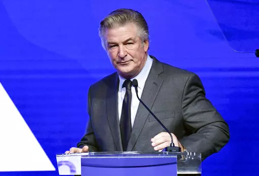 Alec Baldwin performs emcee duties at the Robert F. Kennedy Human Rights Ripple of Hope Award Gala at New York Hilton Midtown on Dec. 9, 2021, in New York.  Baldwin has surrendered his cellphone as part of the investigation into a fatal shooting on a New Mexico film set last fall. A Santa Fe County Sheriff’s Office spokesman says Baldwin’s phone was turned over Friday, Jan. 14, 2022, to authorities in New York's Suffolk County and that information from the phone will be provided to investiga