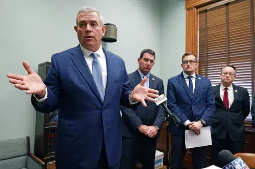 Speaker Philip Gunn, R-Clinton, left, joins other Mississippi House leaders in saying they have signed off on a plan to increase some of the lowest teacher salaries in the nation by an average of $4,850, during an afternoon news briefing at the Mississippi Capitol in Jackson, Miss., Thursday, March 10, 2022. The plan now goes to the Senate for consideration. (AP Photo/Rogelio V. Solis)