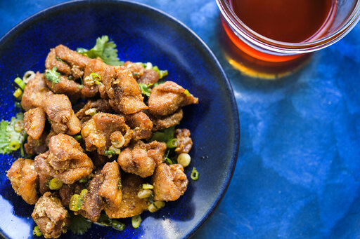 This image released by Milk Street shows a recipe for Crispy Sichuan-Chili Chicken. (Milk Street via AP)