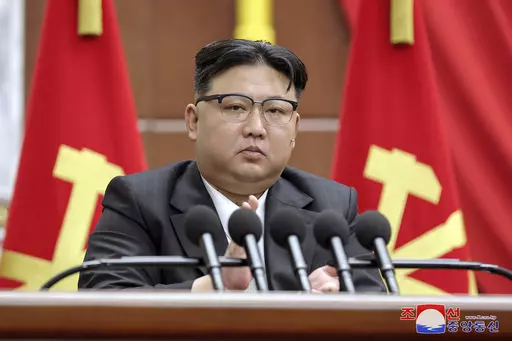 In this photo provided by the North Korean government, North Korean leader Kim Jong Un delivers a speech during a year-end plenary meeting of the ruling Workers’ Party, which was held between Dec. 26, and Dec. 30, 2023, in Pyongyang, North Korea. Independent journalists were not given access to cover the event depicted in this image distributed by the North Korean government. The content of this image is as provided and cannot be independently verified. Korean language watermark on image as pr