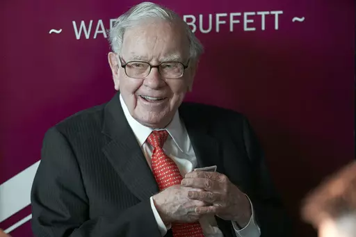 Warren Buffett, chairman and CEO of Berkshire Hathaway, smiles as he plays bridge following the annual Berkshire Hathaway shareholders meeting in Omaha, Neb., May 5, 2019. Buffett's company reported a $12.8 billion loss Saturday, Nov. 4, 2023, as the paper value of its investments fell, but the companies it owns — particularly the insurers — generally performed well.(AP Photo/Nati Harnik, File)