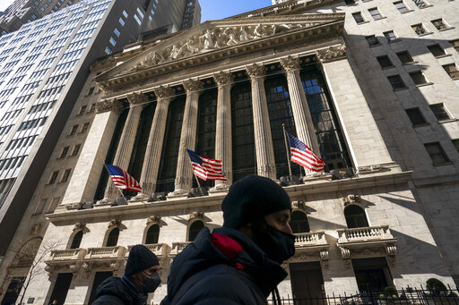 A pedestrian passes the New York Stock Exchange, Monday, Jan. 24, 2022, in New York. Stocks have fallen sharply so far this year as the market readies for the Federal Reserve to raise interest rates to try to tame inflation, which is at its highest level in nearly four decades. (AP Photo/John Minchillo)
