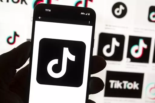 The TikTok logo is seen on a cell phone on Oct. 14, 2022, in Boston. On Thursday, Jan. 12, 2023, Wisconsin became the latest state to ban the use of TikTok on state phones and other devices, a move that comes amid a push for a federal ban and after nearly half of the states nationwide have blocked the popular app. (AP Photo/Michael Dwyer, File)