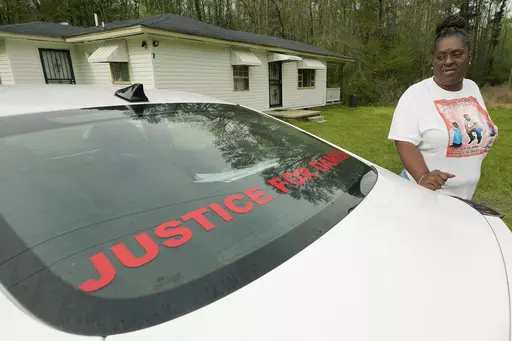 Monica Lee stands outside her eldest son's house in Braxton, Miss., March 21, 2023, as she talks about her youngest son, Damien Cameron. The 29-year-old Black man, with a history of mental illness, died in July 2021 after being arrested by two Rankin County sheriff's deputies. A civil suit can continue against a former Mississippi deputy who pleaded guilty on Aug. 3 to torturing and shooting a Black man in the mouth, with the suit alleging the former deputy is also responsible for the death of a