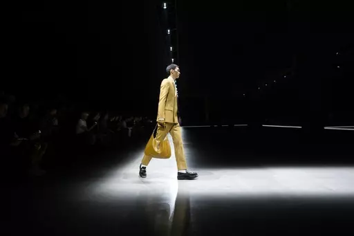 A model wears a creation as part of the men's Gucci Fall-Winter 2024-2025 collection, that was presented in Milan, Italy, Friday, Jan. 12, 2024. (AP Photo/Luca Bruno).