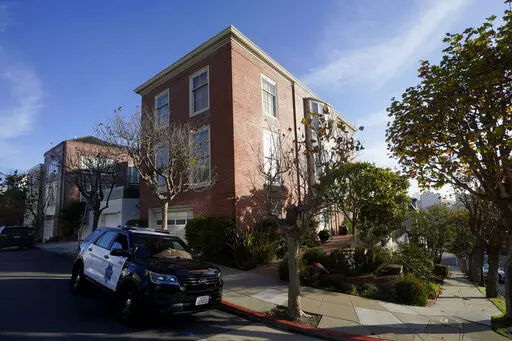 A San Francisco Police Department vehicle parks outside the home of Speaker of the House Nancy Pelosi, in San Francisco, Saturday, Oct. 29, 2022.  On Friday, Nov. 4, The Associated Press reported on stories circulating online incorrectly claiming the attack on Paul Pelosi was a “Domestic Violence Case in a consensual sexual relationship." (AP Photo/Jeff Chiu, File)