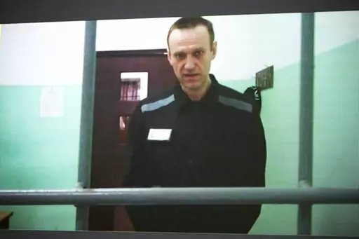 Russian opposition leader Alexei Navalny is seen on a TV screen as he appears in a video link provided by the Russian Federal Penitentiary Service from the colony in Melekhovo, Vladimir region, during a hearing at the Russian Supreme Court in Moscow, Russia, on June 22, 2023. The Kremlin on Tuesday Dec. 12, 2023 bristled at the U.S. voicing concern about Navalny who has vanished from his prison colony, denouncing it as “inadmissible interference” in the country's domestic affairs. Worries ab