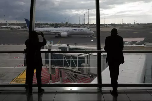 People look at a United Airlines flight leaving for Newark, NJ, at Fiumicino's Leonardo Da Vinci airport, near Rome, Monday, Nov. 8, 2021.    Experience may be the best teacher when traveling. (AP Photo/Alessandra Tarantino, File)