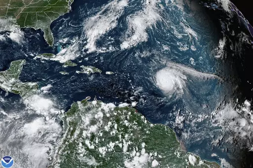 This satellite image provided by the National Oceanic and Atmospheric Administration shows Hurricane Sam, center right, in the Atlantic Ocean, Monday, Sept. 27, 2021, at 3:20 p.m. ET. On Tuesday, May 24, 2022, federal meteorologists say the Atlantic should expect another extra busy hurricane season in 2022. Tuesday's National Oceanic and Atmospheric Administration's Atlantic hurricane season forecast calls for 14 to 21 named storms, with six to 10 becoming hurricanes. (NOAA via AP, File)