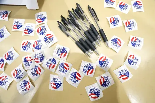 Pens are encircled by "I Voted" stickers at an election precinct in Jackson, Miss., March 12, 2024. A federal appeals court ruled Thursday, July 18, that Mississippi legislators, not the courts, must decide whether to change the state's practice of stripping voting rights from people convicted of certain felonies. (AP Photo/Rogelio V. Solis, File)