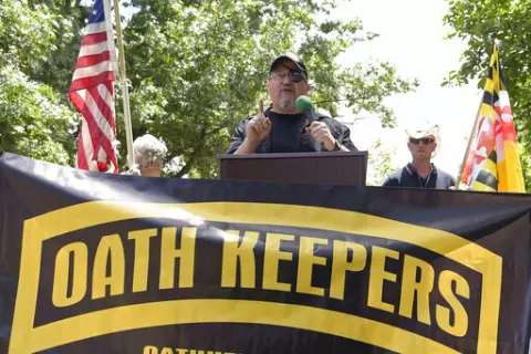 Stewart Rhodes, founder of the Oath Keepers, center, speaks during a rally outside the White House in Washington, June 25, 2017. A new report says that the names of hundreds of U.S. law enforcement officers, elected officials and military members appear on the leaked membership rolls of a far-right extremist group that's accused of playing a key role in the Jan. 6, 2021, riot at the U.S. Capitol. The Anti-Defamation League Center on Extremism pored over more than 38,000 names on leaked Oath Keep