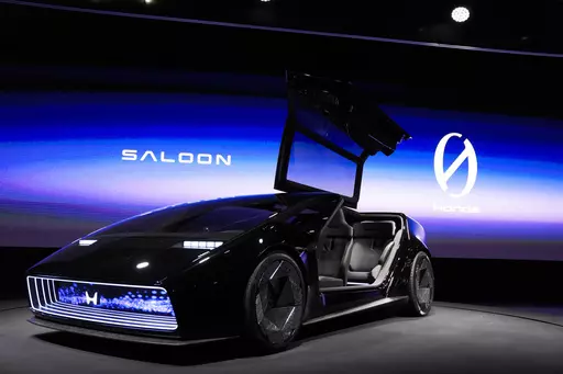 The newly unveiled concept car, Honda Zero Series "Saloon" electric vehicle is displayed during a Honda news conference during the CES tech show Tuesday, Jan. 9, 2024, in Las Vegas. Taking design cues from seemingly everything from a ground-hugging sports car to a 1980s-era Dustbuster vacuum cleaner, the Honda Saloon concept vehicle is a hint at the Japanese automaker’s EV strategy and upcoming designs. (AP Photo/Ryan Sun, File)
