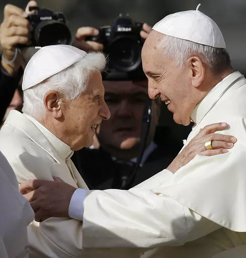 Pope Francis, right, hugs Pope Emeritus Benedict XVI prior to the start of a meeting with elderly faithful in St. Peter's Square at the Vatican, Sunday, Sept. 28, 2014. Pope Francis on Wednesday, Dec. 28, 2022, said his predecessor, Pope Emeritus Benedict XVI, is “very sick," and he asked the faithful to pray for the retired pontiff so God will comfort him “to the very end.” (AP Photo/Gregorio Borgia, File)