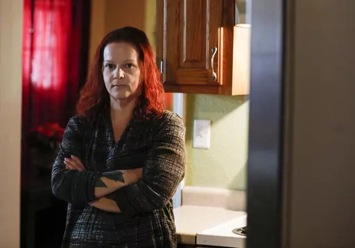 Mylissa Farmer stands for a portrait at her home in Joplin, Mo., on Sept. 28, 2022. In early August, Farmer had to travel to Illinois to terminate her pregnancy when her water broke at 17 weeks and 5 days and put her life in danger. (Nathan Papes/The Springfield News-Leader via AP, File)
