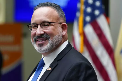 Secretary of Education Miguel Cardona speaks during a visit with first lady Jill Biden to Bergen Community College in Paramus, N.J., Jan. 20, 2022. The Biden administration plans to freeze federal student loan payments through Aug. 31, extending a moratorium that has allowed millions of Americans to postpone payments during the coronavirus pandemic. The decision was confirmed by an administration official familiar with the White House’s decision-making. (AP Photo/Seth Wenig, File)