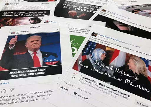 Printouts of some of the Facebook and Instagram ads linked to a Russian effort to disrupt the American political process and stir up tensions around divisive social issues, released by members of the U.S. House Intelligence committee, photographed in Washington, are photographed on Nov. 1, 2017. Federal prosecutors and lawyers for Donald Trump have signaled their desire to invoke the 2016 election in the former president's trial on charges of scheming to overturn the results of the 2020 presiden