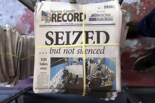 A stack of the Marion County Record sits in the back of the newspaper's building, awaiting unbundling, sorting and distribution, Aug. 16, 2023, in Marion, Kan. The police chief who led a highly criticized raid of the small Kansas newspaper is suspended, the mayor confirmed to The Associated Press on Saturday, Sept. 30. Marion Mayor Dave Mayfield in a text said he suspended Chief Gideon Cody on Thursday, Sept. 28. (AP Photo/John Hanna, File)