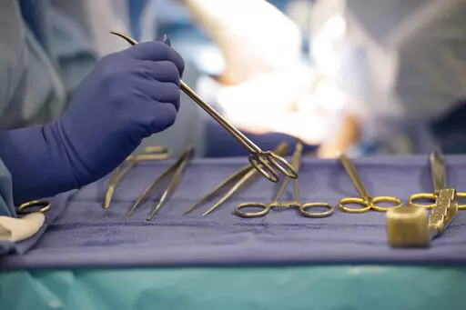 Surgical instruments are used during an organ transplant surgery at a hospital in Washington on Tuesday, June 28, 2016. The U.S. counted its millionth organ transplant on Friday, Sept. 9, 2022, a milestone that comes at a critical time for Americans still desperately waiting for that chance at survival. (AP Photo/Molly Riley)