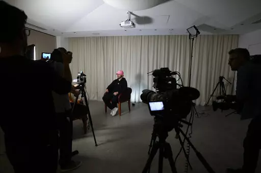 Oleh Psiuk, frontman of Ukraine's Kalush Orchestra talks during an interview in Turin, Italy, Thursday May 5, 2022. Ukrainian band Kalush Orchestra’s upbeat, melodic entry to this month’s Eurovision Song Contest was written as a tribute to the frontman’s mother. But since the Russian invasion of Ukraine, the song called “Stefania” has become an anthem to the country's war-ravaged motherland.  (AP Photo/Antonio Calanni)