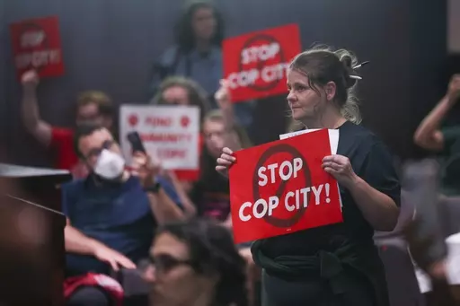 Protestors reacts before council members voted 11-4 to approve legislation to fund the Atlanta Public Safety Training Center, June 6, 2023, in Atlanta. Sixty-one people have been indicted in Georgia on racketeering charges following a long-running state investigation into protests against a proposed police and training facility in the Atlanta area that critics call “Cop City.” The Tuesday, Aug. 29, 2023, indictment under the state’s racketeering law was released by Fulton County officials 