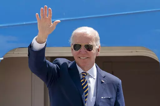 President Joe Biden waves as he boards Air Force One for a trip to South Korea and Japan, on May 19, 2022, at Andrews Air Force Base, Md. China is holding military exercises in the disputed South China Sea coinciding with U.S. President Joe Biden’s visits to South Korea and Japan that are largely focused on countering the perceived threat from China. (AP Photo/Gemunu Amarasinghe, File)