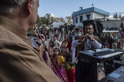 Iraqi Kurds celebrate Nowruz, a Persian New Year, in Sulaimaniyah, Iraq, Monday, March 20, 2023. The Kurdish in Iraq region won de facto self-rule in 1991 when the United States imposed a no-fly zone over it in response to Saddam's brutal repression of Kurdish uprisings. With American invasion 20 years ago much of Iraq fell into chaos, as occupying American forces fought an insurgency and as multiple political and sectarian communities vied to fill the power vacuum left in Baghdad. But the Kurds