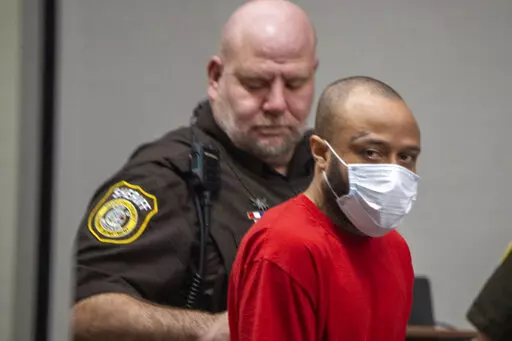 Darrell Brooks Jr. appears in Waukesha County court on Friday, Feb. 11, 2022 in Waukesha, Wis. Brooks Jr., accused of driving his SUV through a Christmas parade in suburban Milwaukee last year, killing six people and injuring dozens more, this week served notice he will try to persuade a jury that he was mentally ill during the incident and if convicted should go to an institution instead of prison. (Derek Johnson/Waukesha Freeman via AP, Pool File)