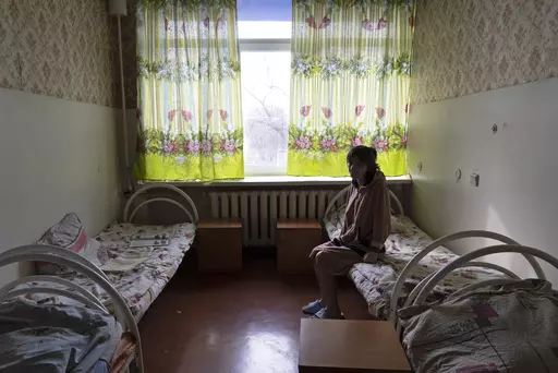 Natalia, 37, a patient, sits in her room at a psychiatric hospital in Kramatorsk, Ukraine, Tuesday March 21, 2023. In December, the World Health Organization said one in five people in countries that have experienced conflict in the past decade will suffer from a mental health condition, and estimated that about 9.6 million people in Ukraine could be affected. Russia’s invasion in February 2022 resulted in millions of people being displaced, bereaved, forced into basements for months due to in