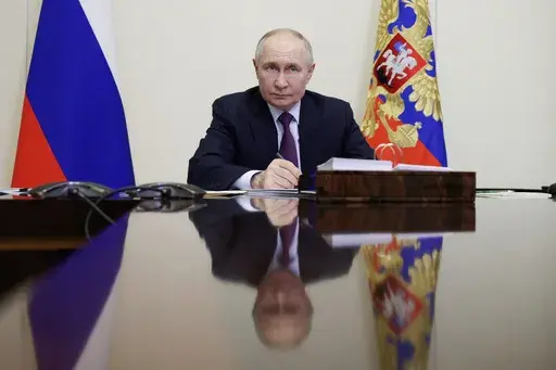 Russian President Vladimir Putin holds a video conference meeting with Bryansk Region Gov. Alexander Bogomaz at the Novo-Ogaryovo state residence outside Moscow Russia, Thursday, Feb. 13, 2025. (Gavriil Grigorov, Sputnik, Kremlin Pool Photo via AP)