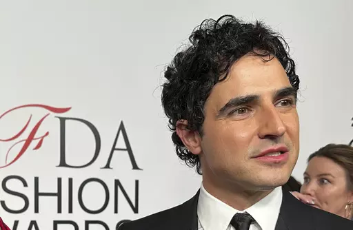 Fashion designer Zac Posen speaks with the media on the red carpet arrival at the Council of Fashion Designers of America awards, Monday, Nov. 6, 2023, in New York. In news announced Monday, Feb. 5, 2024, Gap has tapped Posen as the chain's creative director. (AP Photo/Ted Shaffrey, File)