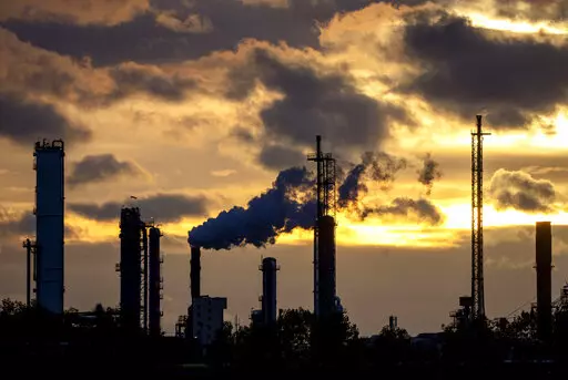 Pollution rises from the BASF chemical plant in Ludwigshafen, Germany, Monday, Nov. 7, 2022. (AP Photo/Michael Probst)