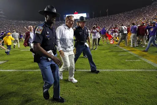 Alabama head coach Nick Saban, center, walks off the field after an NCAA college football game against LSU in Baton Rouge, La., Saturday, Nov. 5, 2022. (AP Photo/Tyler Kaufman)