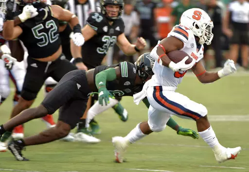 Syracuse running back Sean Tucker (34) evades Ohio defenders during an NCAA college football game, Saturday, Sept. 4, 2021, in Syracuse, N.Y. (N. Scott Trimble/The Post-Standard via AP)