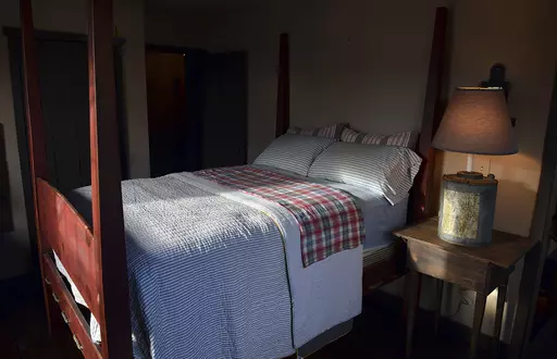 This Nov. 11, 2013 file photo shows a bedroom built by Mike Spangler using some reclaimed materials, in Belle, W.Va. Nearly one-third of American adults don't get the recommended seven to nine hours of sleep per night. Some of the major causes: Stress, anxiety and a culture that experts say is about productivity, not rest. (Craig Cunningham/Charleston Daily Mail via AP, file)