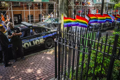 Pride flags, a symbol celebrating the LGBTQ+ community, decorate the fence at the Stonewall National Monument with U.S. Park police present, Tuesday, June 13, 2023, in New York. Dozens of LGBTQ+ Pride flags were damaged and ripped down at the monument over the weekend, the third such bout of vandalism during Pride Month at the LGBTQ+ landmark, police said. (AP Photo/Bebeto Matthews, File)