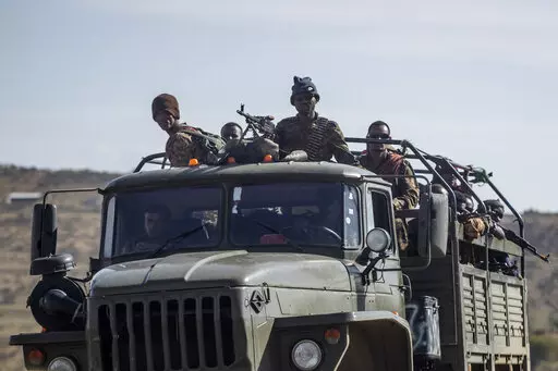 Ethiopian government soldiers ride in the back of a truck on a road near Agula, north of Mekele, in the Tigray region of northern Ethiopia on May 8, 2021. Authorities in Ethiopia's northern Tigray region alleged Wednesday, Aug. 24, 2022 that Ethiopia's military launched a "large-scale" offensive for the first time in a year, while Ethiopia's military spokesman did not immediately respond to questions. (AP Photo/Ben Curtis, File)