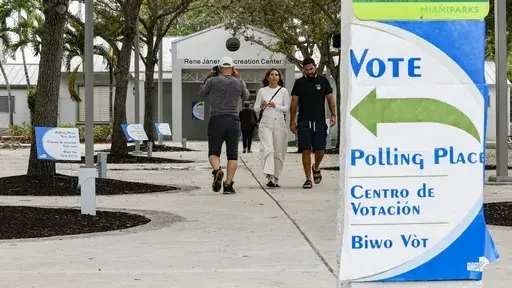 Voters arrive and depart precinct 573 at the Rene Janeiro Recreation Center in Shenandoah Park during Election Day in Miami, Tuesday, Nov. 5, 2024. (Al Diaz//Miami Herald via AP)