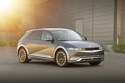 This photo provided by Hyundai shows the 2022 Hyundai Ioniq 5, a small electric SUV with retro-inspired looks and up to 303 miles of EPA-estimated range. (David Dewhurst/Courtesy of Hyundai Motor America via AP)