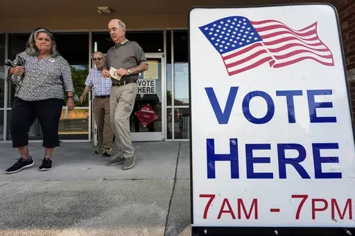 Voters depart an election center during primary voting, May 21, 2024, in Kennesaw, Ga. Conservative groups are systematically attempting to challenge large numbers of voter registrations across the country ahead of this year's presidential election. The strategy is part of a wider effort to raise questions about the integrity of this year's election as former President Donald Trump repeatedly claims without evidence that his opponents are trying to cheat. (AP Photo/Mike Stewart, File)