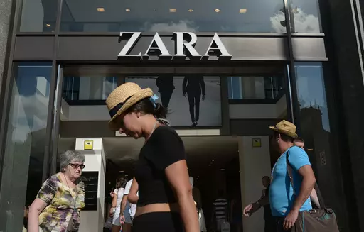 People walk past a Zara store in Barcelona, Spain, Aug. 27, 2014. The Spanish fashion brand Zara has pulled advertising images that to some appeared to reference Israel’s war against Hamas in Gaza. (AP Photo/Manu Fernandez, File)